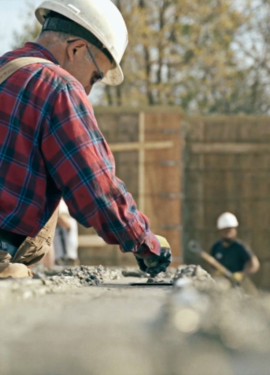 Concrete crew working a foundation pour. 