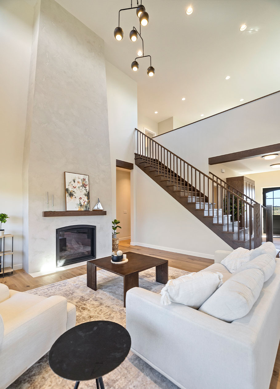 Living room with grand fireplace at 24 Ash Cove.